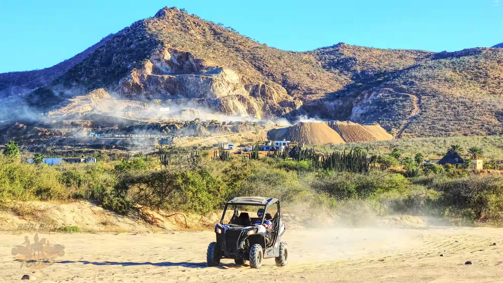 Off-road buggy tour in desert landscape with mountains and geothermal hot springs in Baja California Sur