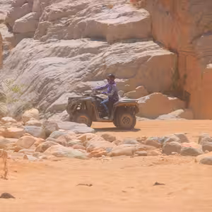 ATV rider navigating a rocky desert canyon near Migrino Beach